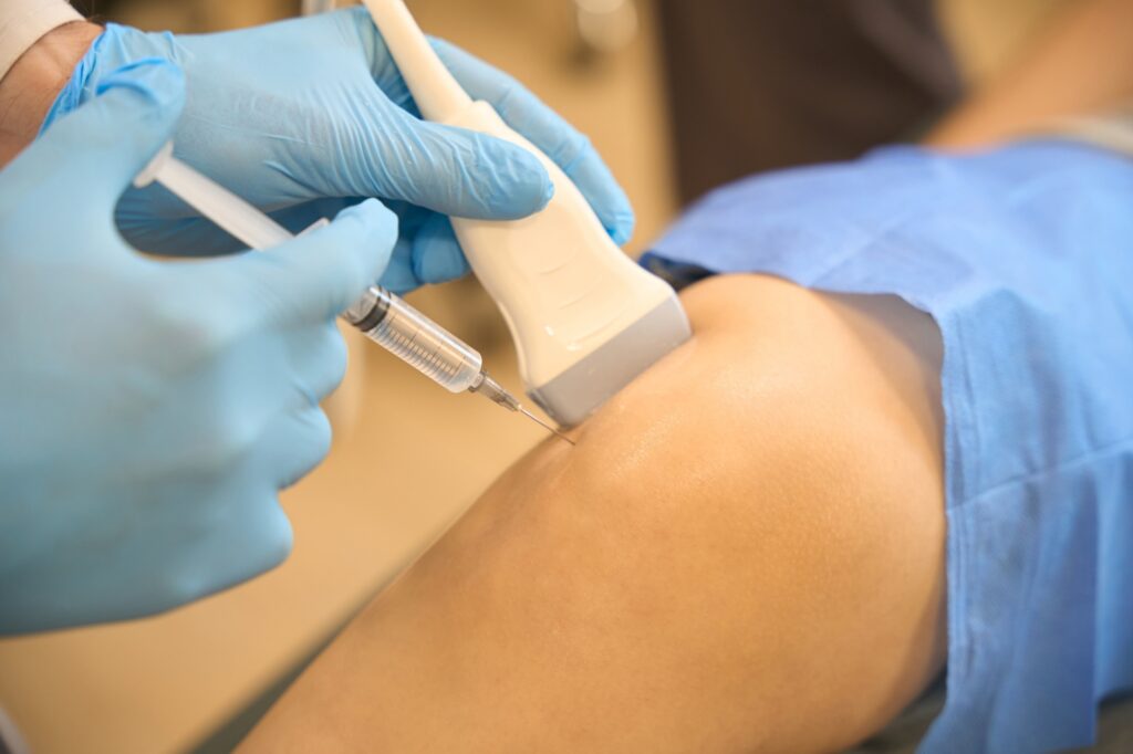 Doctor performing ultrasound guided injections