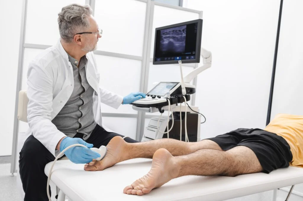 Man having foot scanned using modern ultrasound machine